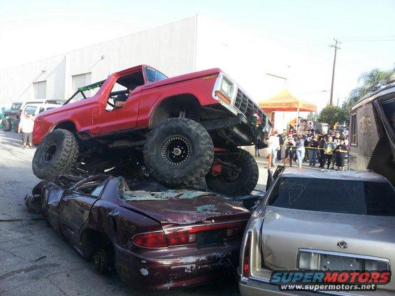 Red 1978 Ford Bronco crushing cars