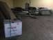 2003 Ford Crown Victoria - Several vehicles are stored inside a garage, with a box in the foreground.