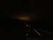 2012 Polaris X-45 - A dark road at night with distant lights and a watermark is visible.