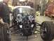 1975 Ford Ranchero - A vehicle is being worked on in a garage, showing its engine and chassis.