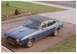 1977 Mercury Capri - A blue 1977 Mercury Capri coupe with a black roof is parked on an asphalt driveway, viewed from a high angle.