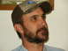 1990 Ford Bronco - A man with a beard and a Ford hat is shown in this close-up photo.