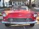 1956 Ford Thunderbird - Front view of a red 1956 Ford Thunderbird with its distinctive grille and headlights.