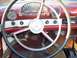 1956 Ford Thunderbird - The dashboard of a 1956 Ford Thunderbird shows its classic interior design with a prominent steering wheel and instrument cluster.