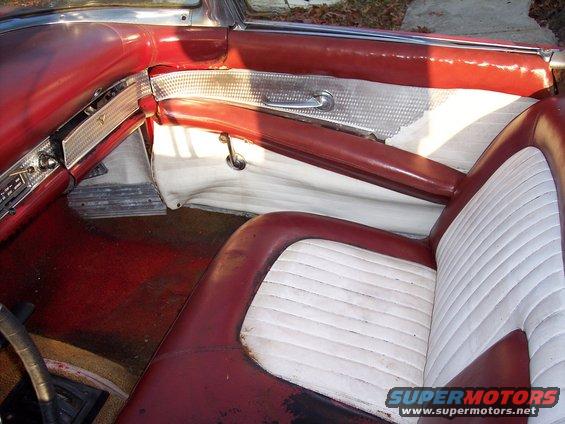 1956 Ford Thunderbird interior with red and white seats and door panel