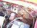 1956 Ford Thunderbird - The engine bay shows significant rust and wear on its components.