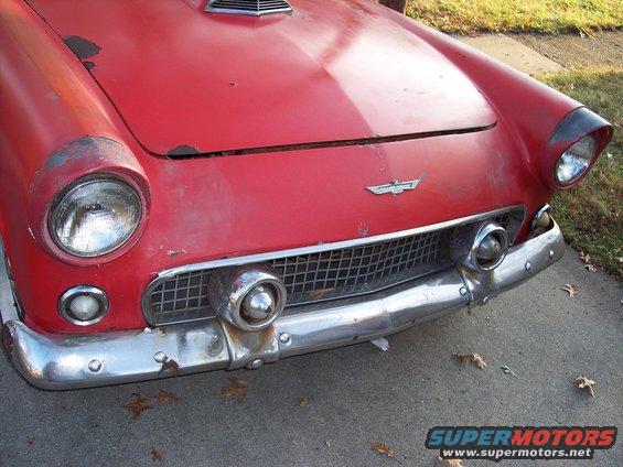 Red 1956 Ford Thunderbird front end with chrome grille and bumper