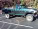 1996 Ford F-250 - This lifted Ford F-250 truck has a two-tone paint scheme and aggressive off-road tires.