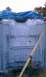 1994 Ford F-250 - The underside of a vehicle frame is visible, covered by a blue tarp and secured with a strap.