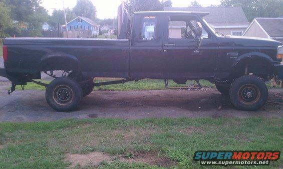 black pickup truck, side view, lifted suspension