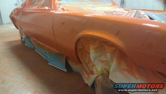 Orange 1973 Chevrolet Camaro side view during paint job