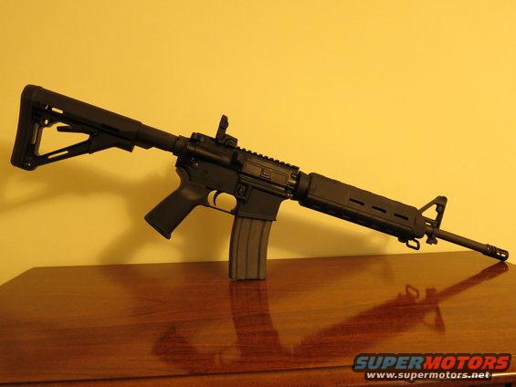 AR-15 style rifle on a wooden table
