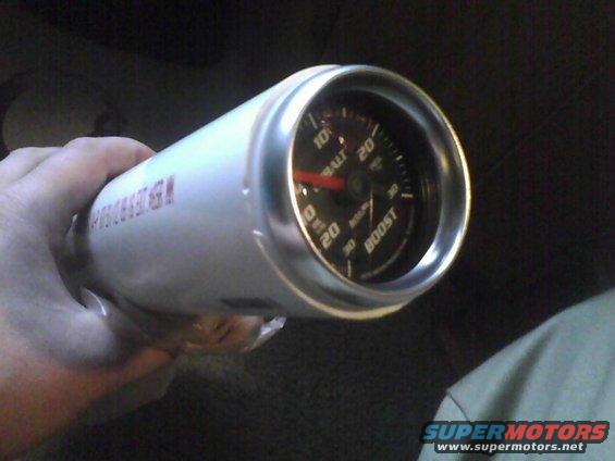 White boost gauge with red needle and silver bezel