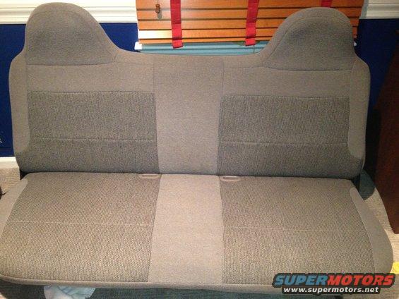 Gray fabric bench seat with two headrests and a center stripe