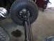 1994 Ford Bronco - This image shows the suspension and tire of a vehicle, possibly undergoing modification or repair.