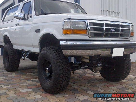 White lifted 1994 Ford Bronco front 3/4 view