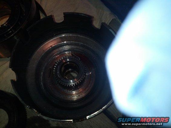 Close-up of a disassembled transmission component with gears visible inside