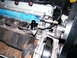 2004 Ford Crown Victoria - Close-up view of an engine component with a black sensor and wiring attached.