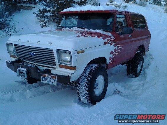 1978 Ford Bronco with flame decals in snow, Utah license plate C09 2CN