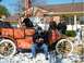 1912 Ford Model T - A group poses with an early 20th-century touring car on a snowy day.
