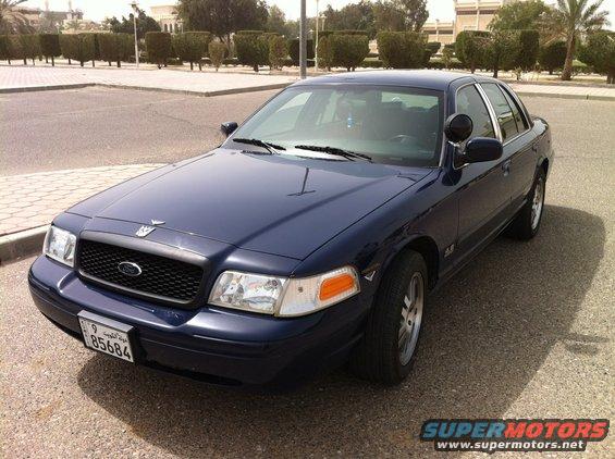 Dark blue 2007 Ford Crown Victoria, 3q front view. License plate 85684