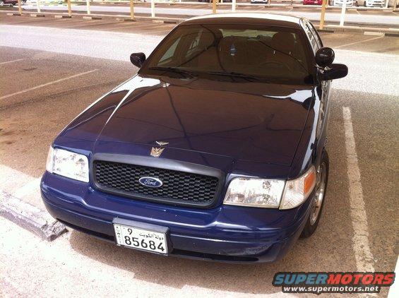 Dark blue 2007 Ford Crown Victoria parked in a lot, front view