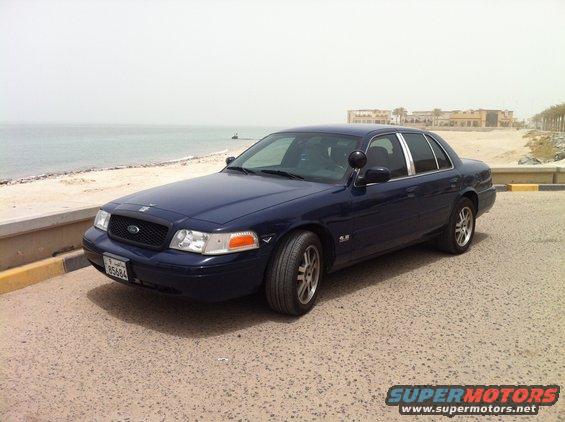 Dark blue 2007 Ford Crown Victoria parked by the sea