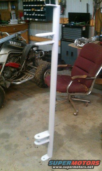 white metal part with brackets