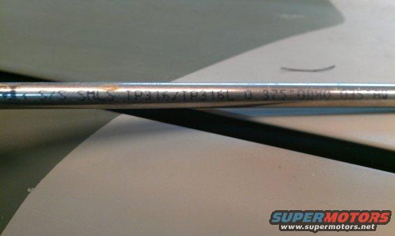 Metal tube with etched text 'SYS SMLS TP316/TP316L 0.375" 00X0 0.125" HW'