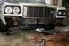 1976 Ford Ranchero - The front of a 1976 Ford Gran Torino is shown with the bumper removed, revealing the grille and radiator.
