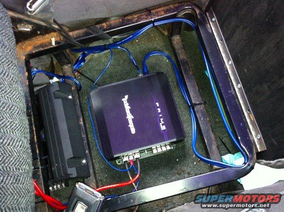 Amps installed under the center seat.