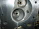 1988 Ford Mustang - Close-up view of an engine cylinder head, showing the ports for intake and exhaust valves.