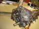 1988 Ford Mustang - Close-up view of an engine block's timing chain and gears, with visible casting numbers.