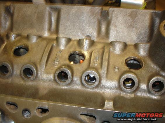 Engine block with visible casting numbers and bolt holes