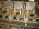 1988 Ford Mustang - Close-up view of an engine block, showing casting marks and openings for internal components.