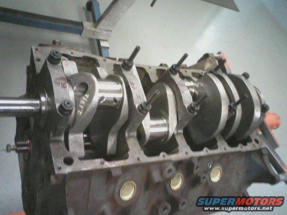 Engine block with crankshaft and connecting rods, partially assembled