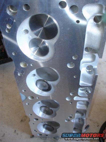 Engine cylinder head with multiple valves and ports