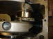 1988 Ford Mustang - This image shows a close-up view of an engine's internal components, specifically the crankshaft and a connecting rod bearing.