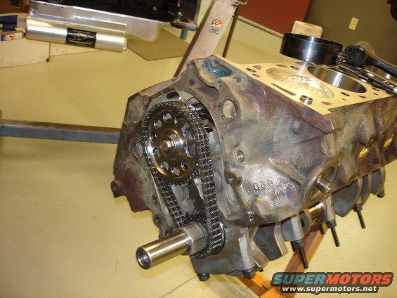 Engine block showing timing chain and gears. Some numbers are visible on the block