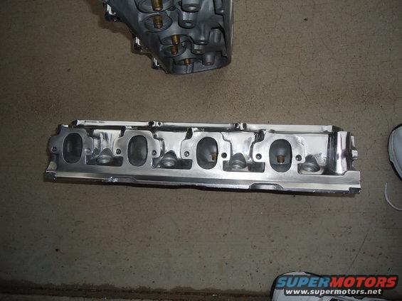 engine cylinder head with intake ports visible