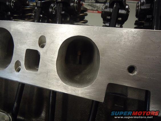Aluminum engine cylinder head with visible valve ports and rocker arms