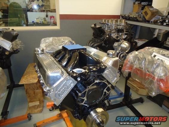 Engine with chrome valve covers and intake manifold on an engine stand