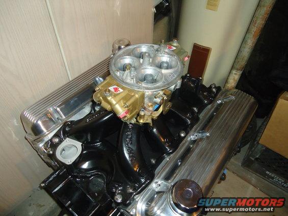 Engine with chrome valve covers and a gold carburetor