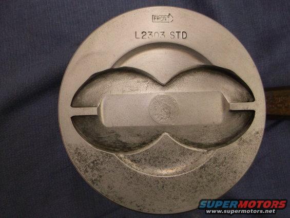 Piston marked L2303 STD with a front indicator