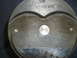 1971 Ford Ranchero - A close-up view of a TRW piston, showing its part number and some wear marks.