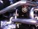 1970 Volkswagen Beetle - The engine compartment features a custom exhaust system and various engine components.