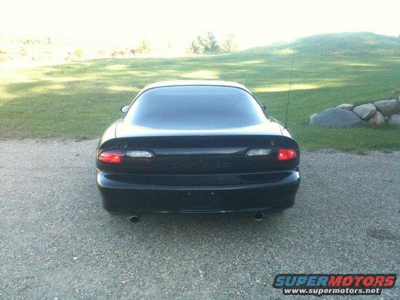 Black 1998 Chevrolet Camaro rear view with dual exhaust pipes