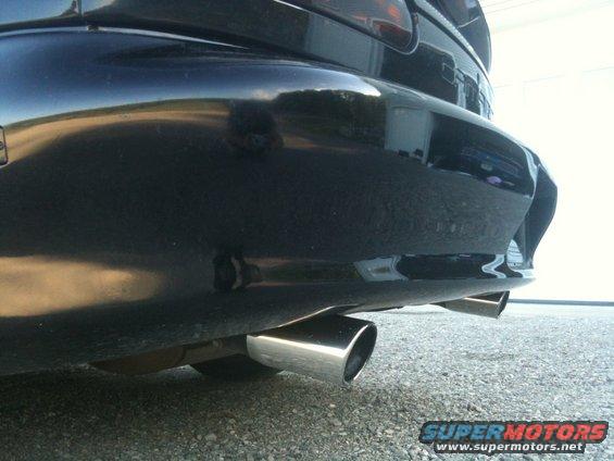 Black 1998 Chevrolet Camaro rear bumper with dual exhaust pipes