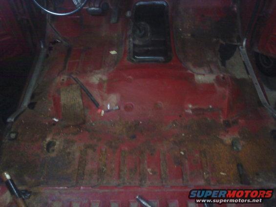 1978 Ford Bronco interior floor pan, showing rust and missing carpet