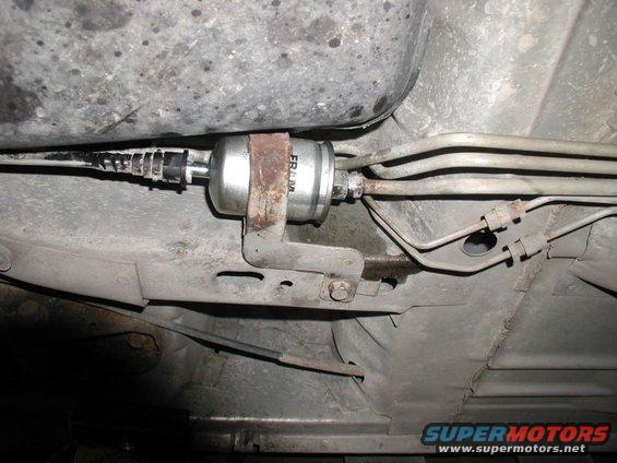 underbody shot of a fuel filter with fuel lines
